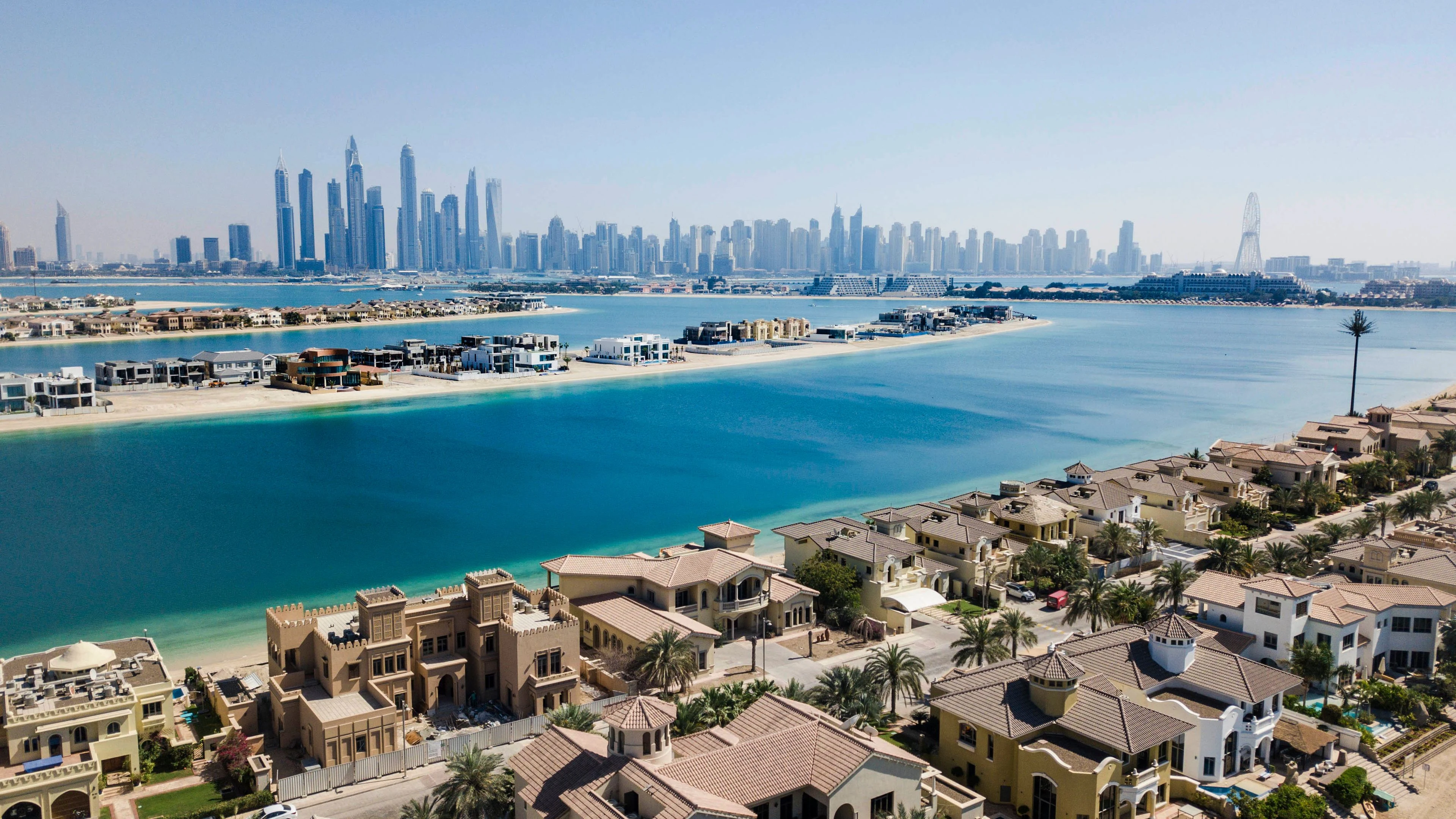 Aerial view of Palm Jumeirah villas with landscaped gardens in Dubai